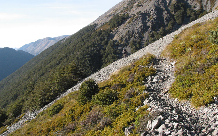 Rider crossing a scree slope in Craigieburn Forest Park